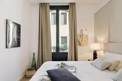 a living room with a couch and a table at Batipaglia - 2 bedrooms and terrace in Ciutat Vella in Barcelona