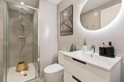 a kitchen with white cabinets and a washer and dryer at Batipaglia - 2 bedrooms and terrace in Ciutat Vella in Barcelona