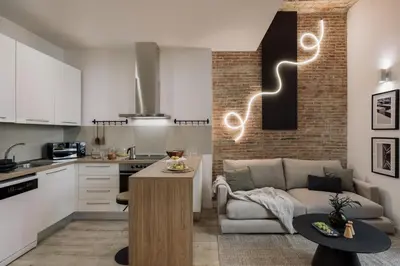 a living room with a couch and a table at Chuck - 2 bedrooms and balcony in Sant Antoni in Barcelona