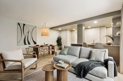 a bedroom with a bed and a mirror and a balcony at Begur - 3 bedrooms and terrace in Sant Gervasi in Barcelona