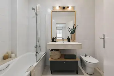 a bedroom with a large bed with a gray blanket at Sabia - 2 bedrooms in Poblenou in Barcelona