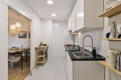 a bedroom with a bed and a large window at Sabia - 2 bedrooms in Poblenou in Barcelona