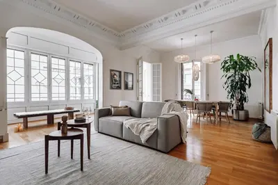 a living room with a couch and a table at Vico - 4 bedrooms and office in Eixample Dreta in Barcelona