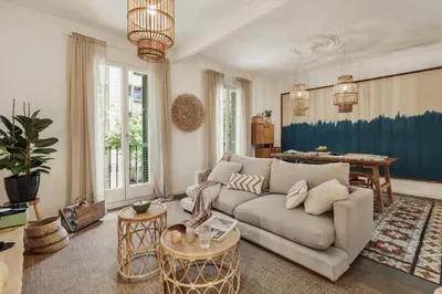 a living room with a couch and a table at Meko - 2 bedrooms and balcony in Eixample Esquerra in Barcelona