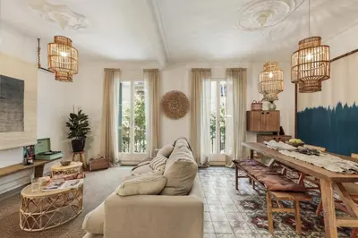 a living room with a couch and a table at Meko - 2 bedrooms and balcony in Eixample Esquerra in Barcelona