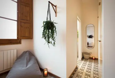 a bedroom with a bed and a desk and a mirror at Mahoro - 3 bedrooms in Ciutat Vella in Barcelona