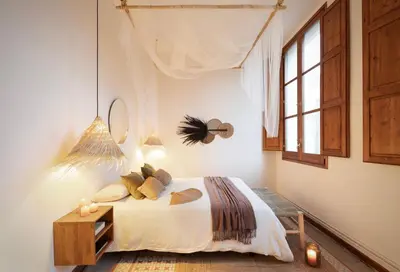 a living room with a couch and a hanging plant at Mahoro - 3 bedrooms in Ciutat Vella in Barcelona