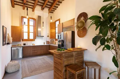 a living room with a white couch and a table at Mahoro - 3 bedrooms in Ciutat Vella in Barcelona