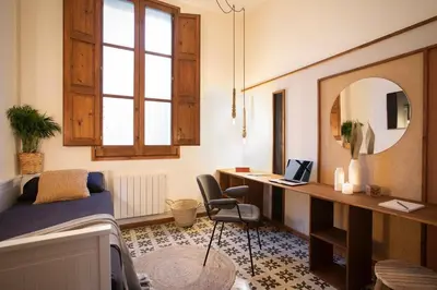 a living room with a couch and a table at Mahoro - 3 bedrooms in Ciutat Vella in Barcelona