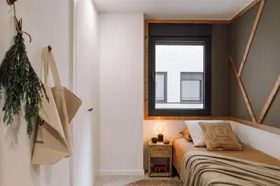 a hallway with white walls and pictures on the wall at Dabo - 3 bedrooms in Eixample Esquerra in Barcelona