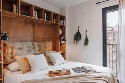 a kitchen and living room with a table and chairs at Dabo - 3 bedrooms in Eixample Esquerra in Barcelona