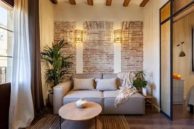 a bathroom with a shower and a toilet and a sink at Atuh - Studio and terrace in El Born in Barcelona