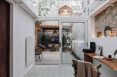 a patio with a wooden pergola at Ejido - 1 bedroom and terrace in Gràcia in Barcelona
