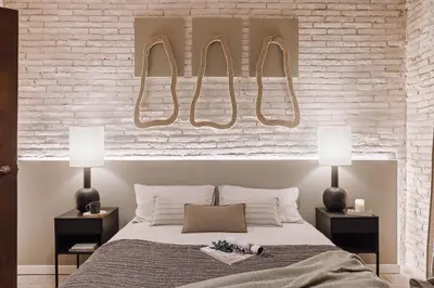 a white kitchen with white cabinets and a sink at Ejido - 1 bedroom and terrace in Gràcia in Barcelona