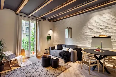 a bedroom with a bed and a large window at Baharya - 2 bedrooms in Eixample Dreta in Barcelona