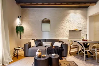 a bedroom with a bed and a side table at Baharya - 2 bedrooms in Eixample Dreta in Barcelona