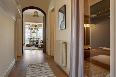 a room with a desk and some pictures on the wall at Atins - 2 bedrooms in Eixample Dreta in Barcelona