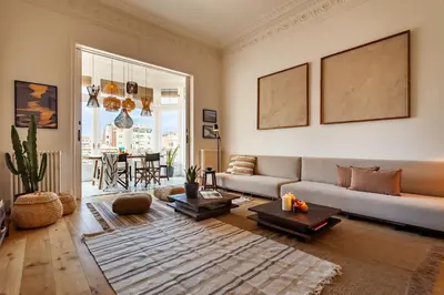 a living room with a couch and a table at Atins - 2 bedrooms in Eixample Dreta in Barcelona