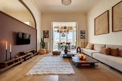 a dining room with a table and a balcony at Atins - 2 bedrooms in Eixample Dreta in Barcelona