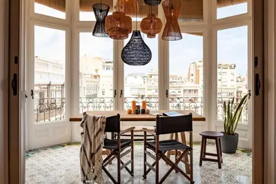 a bedroom with a large bed and a black wall at Atins - 2 bedrooms in Eixample Dreta in Barcelona