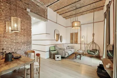 a white bathroom with a toilet and a shower at Malang - 2 bedrooms with terrace in Gràcia in Barcelona
