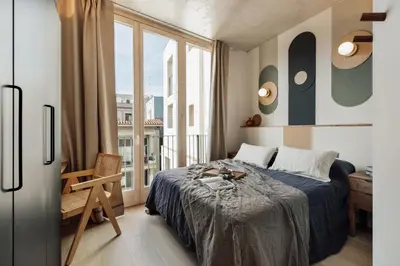 a living room with a tv on a wall at Kevran - 2 bedrooms and terrace in Sant Pere in Barcelona