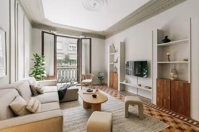 a living room with a couch and a table at Albori - 2 bedrooms and balcony in Eixample Dreta in Barcelona