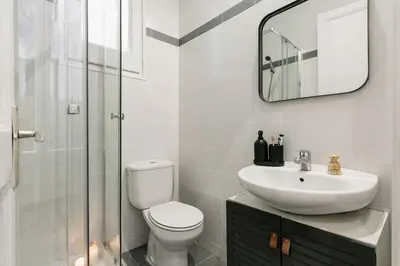a bedroom with a bed and a desk in a room at Albori - 2 bedrooms and balcony in Eixample Dreta in Barcelona