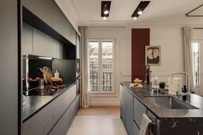a dining room and living room with a table and chairs at Fener - 3 bedrooms in La Dreta de l'Eixample in Barcelona