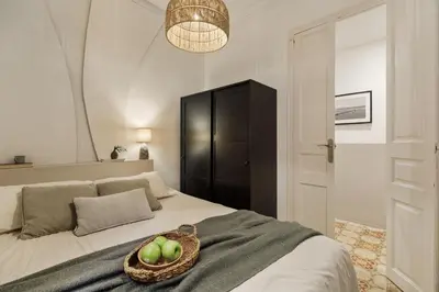 a small kitchen with a sink and a stove at Pano - 2 bedrooms in St Pere Sta Caterina i Ribera in Barcelona
