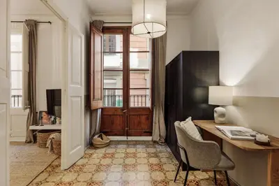 a home office with a desk and a table with a chair at Pano - 2 bedrooms in St Pere Sta Caterina i Ribera in Barcelona