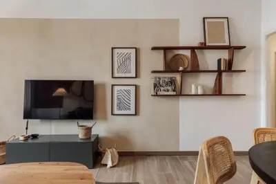a living room with a couch and a table at Gumus - 3 bedrooms and office in Les Tres Torres in Barcelona