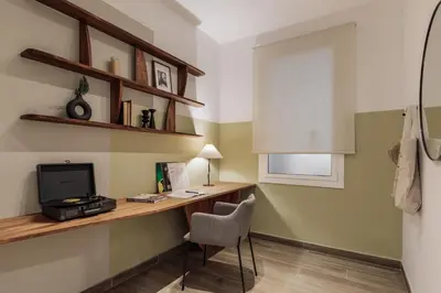 a living room with a couch and a table at Gumus - 3 bedrooms and office in Les Tres Torres in Barcelona
