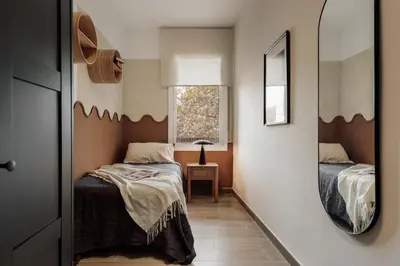 a living room with a tv and a table at Gumus - 3 bedrooms and office in Les Tres Torres in Barcelona