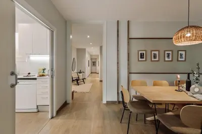 a living room with a couch and a table at Yaxha - 4 bedrooms and terrace in Eixample Dreta in Barcelona