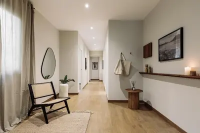 a living room with a couch and a table at Yaxha - 4 bedrooms and terrace in Eixample Dreta in Barcelona