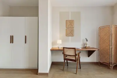 a bedroom with a large bed and a pendant light at Yaxha - 4 bedrooms and terrace in Eixample Dreta in Barcelona
