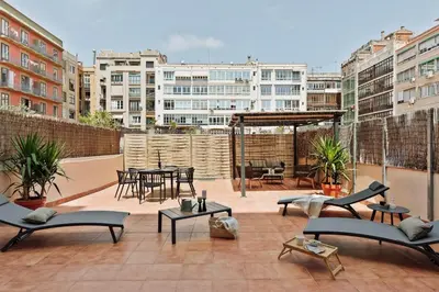 a bedroom with a large bed and two lamps at Yaxha - 4 bedrooms and terrace in Eixample Dreta in Barcelona