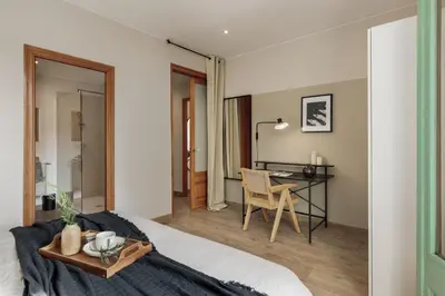a living room with a table and a couch at Amatitlan - 3 bedrooms and balcony in Eixample in Barcelona