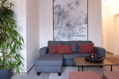 a bedroom with a bed and a chair and a window at Yoko - 3 bedrooms and terrace in Eixample Dreta in Barcelona