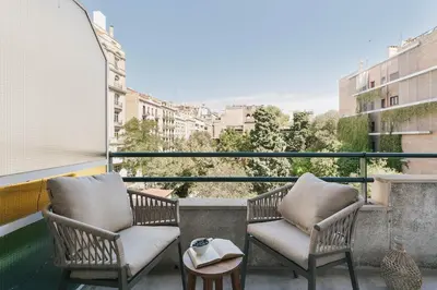 a living room with a couch and a table at Arienzo - 2 bedrooms and balcony in Sant Gervasi in Barcelona