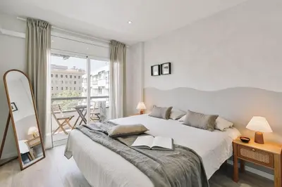 a living room with a couch and a table at Arienzo - 2 bedrooms and balcony in Sant Gervasi in Barcelona