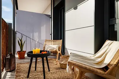 a living room with a couch and a table at Asrir - 2 bedroom, terrace and pool in Poblenou in Barcelona
