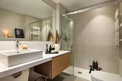 a bedroom with a large bed with two tables at Asrir - 2 bedroom, terrace and pool in Poblenou in Barcelona