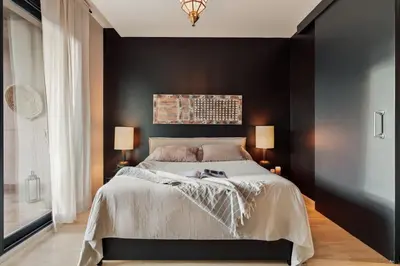 a living room and kitchen with a couch and a table at Wabi - 2 bedrooms and terrace in Passeig de Gràcia in Barcelona