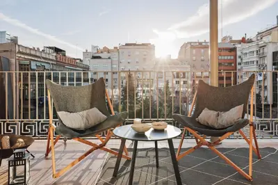 a bedroom with a large bed and a large window at Wabi - 2 bedrooms and terrace in Passeig de Gràcia in Barcelona