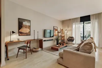 two chairs and a table on a balcony with a view at Wabi - 2 bedrooms and terrace in Passeig de Gràcia in Barcelona