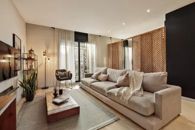 a bathroom with a sink and some lights in it at Wabi - 2 bedrooms and terrace in Passeig de Gràcia in Barcelona