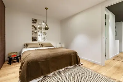 a hallway with white walls and wood floors at Chalby - 4 bedrooms in Eixample Esquerra in Barcelona