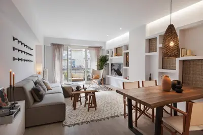 a living room with a couch and a table at Talat - 3 bedrooms in Eixample Esquerra in Barcelona